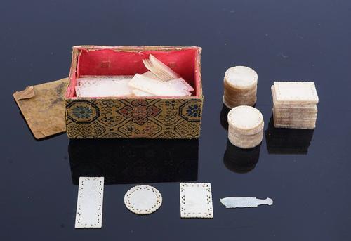 A COLLECTION OF APPROXIMATELY 130 CHINESE MOTHER OF PEARL GAMING COUNTERS (130)