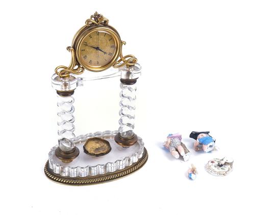 A VICTORIAN GILT-METAL AND GLASS MANTEL TIMEPIECE