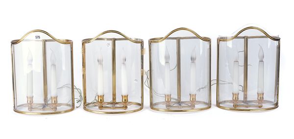 A SET OF FOUR BRASS AND GLASS STORM LANTERNS