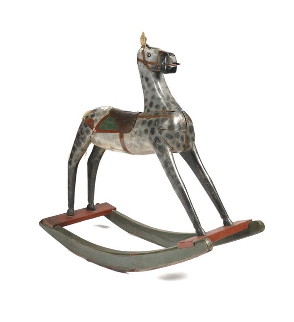 A PAINTED WOODEN ROCKING HORSE