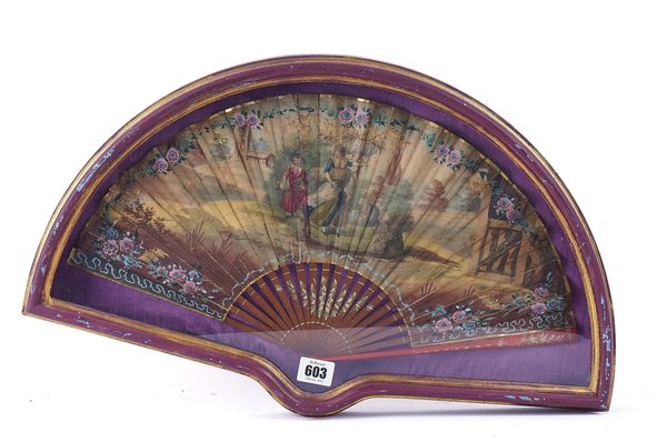 A EUROPEAN RED LACQUERWARE HAND-PAINTED FAN