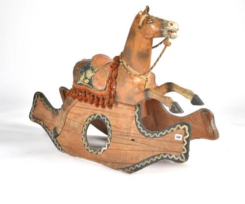 A PAINTED PINE AND PAPIER-MACHE CHILD'S ROCKING HORSE