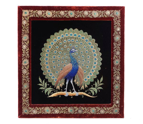 A SOUTH EAST ASIAN EMBROIDERED PANEL OF A PEACOCK