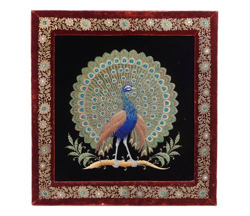 A SOUTH EAST ASIAN EMBROIDERED PANEL OF A PEACOCK