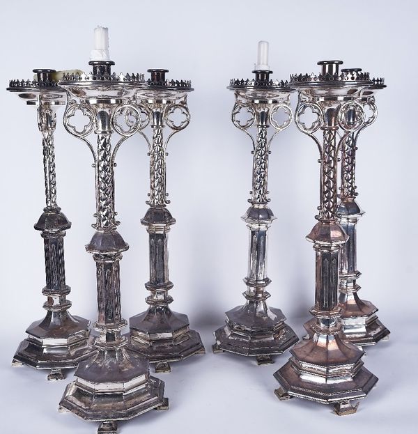 A SET OF SIX VICTORIAN SILVER-PLATED GOTHIC REVIVAL CANDLESTICKS (6)