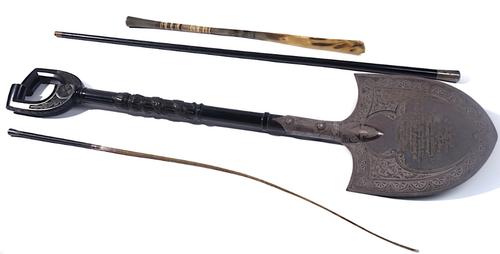 A VICTORIAN EBONY MOUNTED SILVER-PLATED PRESENTATION SPADE FOR THE GLASGOW INDUSTRIAL EXHIBITION, TOGETHER WITH A WALKING CANE AND OTHER ITEMS (4)