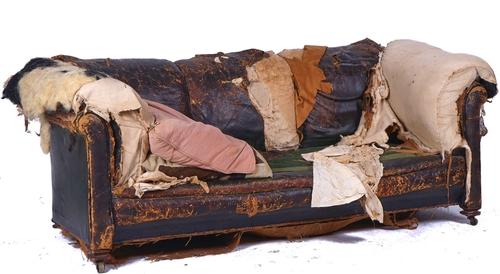 A VICTORIAN LEATHER UPHOLSTERED CHESTERFIELD SOFA