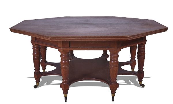 IN THE MANNER OF PHILLIP WEBB; A VICTORIAN OAK OCTAGONAL CENTRE TABLE