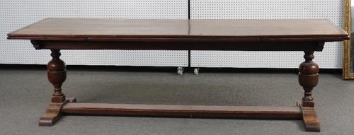 A 17TH CENTURY STYLE OAK DRAWLEAF EXTENDING DINING TABLE