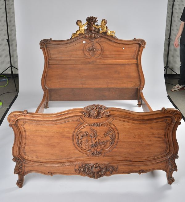 A 19TH CENTURY FRENCH CARVED WALNUT DOUBLE BED