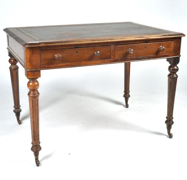 A VICTORIAN OAK WRITING DESK