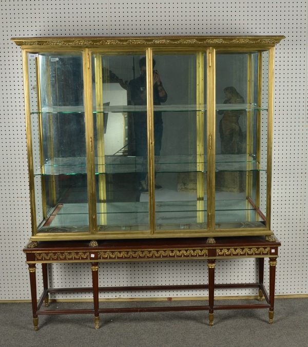 A LACQUERED BRASS MIRROR BACKED DISPLAY CABINET (2)