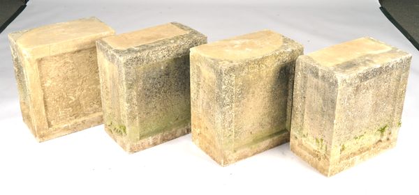 A SET OF FOUR RECTANGULAR CARVED STONE PEDESTALS (4)