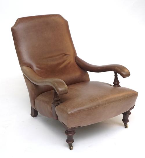 A MODERN VICTORIAN STYLE LEATHER UPHOLSTERED ARMCHAIR