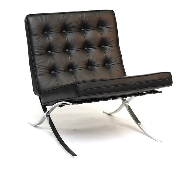 AFTER A DESIGN BY MIES VAN DER ROHE & REICH; A POLISHED CHROME ‘BARCELONA’ LOUNGE CHAIR