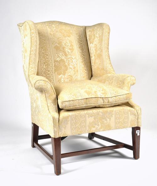 A GEORGE II STYLE WING BACK ARMCHAIR