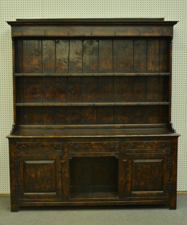 OAK APPLE TRADING; AN 18TH CENTURY FIGURED OAK DRESSER