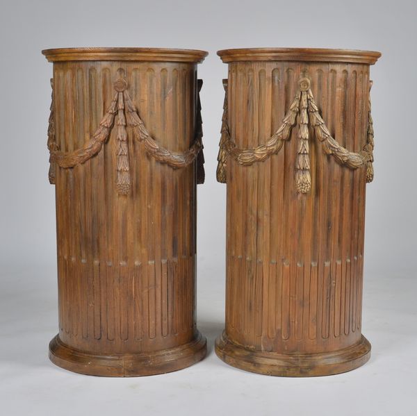 A PAIR OF STAINED HARDWOOD FLUTED COLUMNS (2)