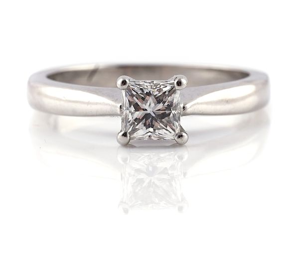 A PLATINUM AND DIAMOND SINGLE STONE RING