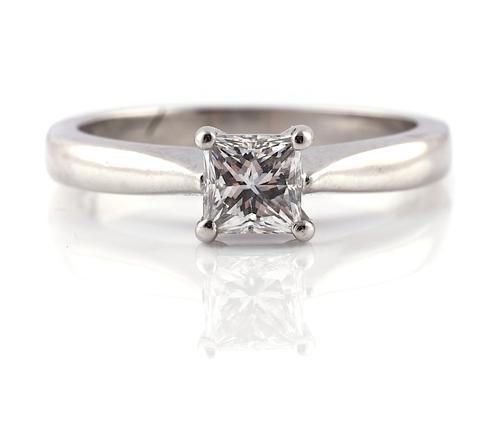 A PLATINUM AND DIAMOND SINGLE STONE RING