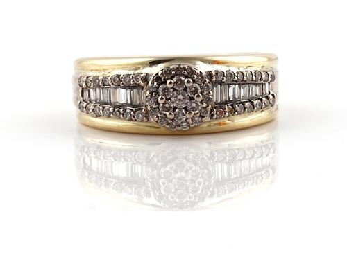 A GOLD AND DIAMOND RING