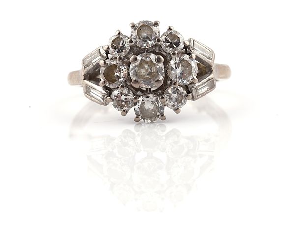 A DIAMOND NINE STONE CLUSTER RING