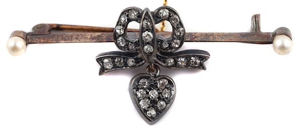 A DIAMOND BOW AND HEART BAR BROOCH