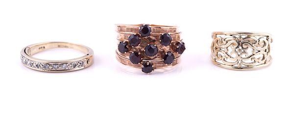 A GOLD AND GARNET NINE STONE RING AND TWO FURTHER GOLD RINGS (3)