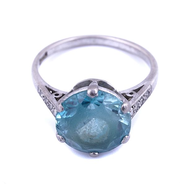 A WHITE GOLD, BLUE ZIRCON AND DIAMOND RING