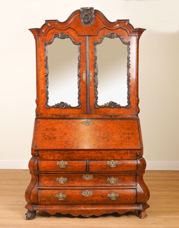 AN 18TH CENTURY DUTCH POLLARD OAK BUREAU BOOKCASE WITH BOMBE FOUR DRAWER BASE