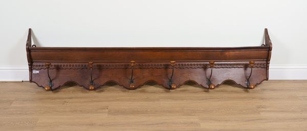 A 19TH CENTURY FRENCH WALNUT AND WROUGHT IRON WALL MOUNTED COAT/HAT RACK