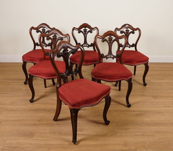 A SET OF SIX 19TH CENTURY CARVED MAHOGANY FRAMED SHIELD BACK DINING CHAIRS  (6)