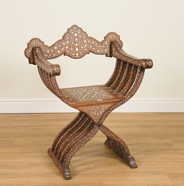 AN EARLY 20TH CENTURY MIDDLE EASTERN BONE INLAID HARDWOOD FOLDING X-FRAME OR SAVONAROLA CHAIR