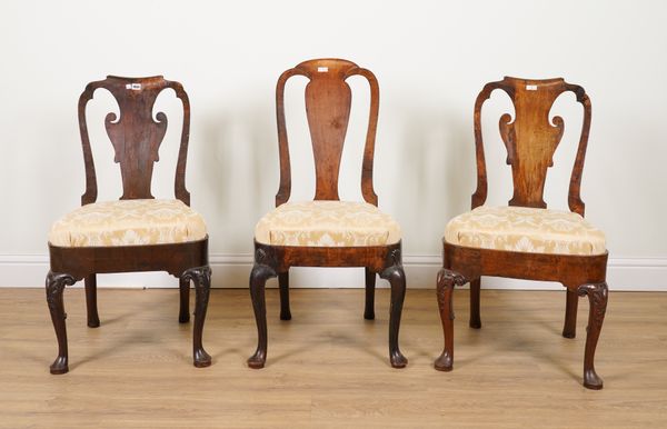 A PAIR OF EARLY 18TH CENTURY/ QUEEN ANNE WALNUT FRAMED VASE BACK DINING CHAIRS ON SHELL CAPPED PAD FEET (3)