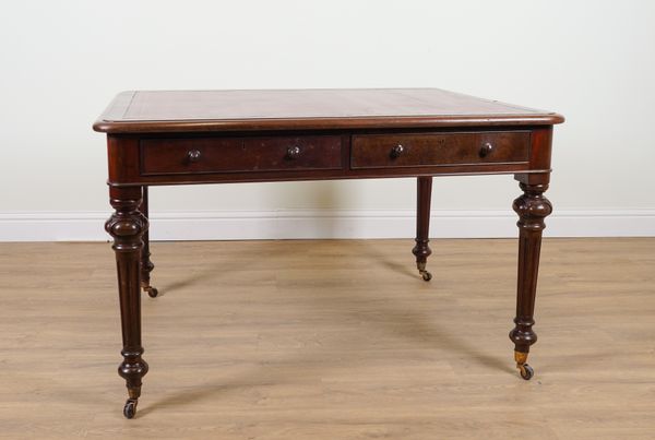 A VICTORIAN MAHOGANY LEATHER INSET CENTRE WRITING TABLE