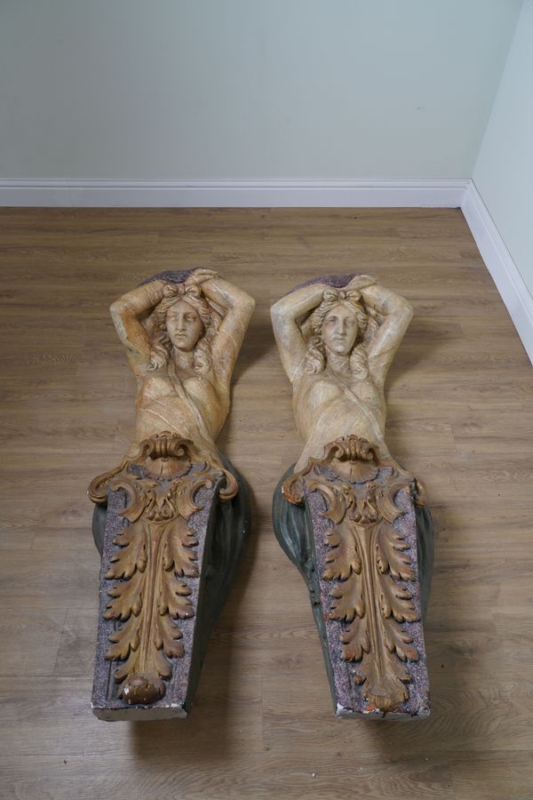 A PAIR OF ITALIAN POLYCHROME PAINTED PLASTER CARYATID ARCHITECTURAL ELEMENTS (2)