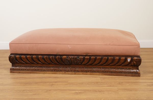 A LARGE CONTINENTAL CARVED WALNUT RECTANGULAR LIFT-TOP OTTOMAN WITH GADROONED FRIEZE