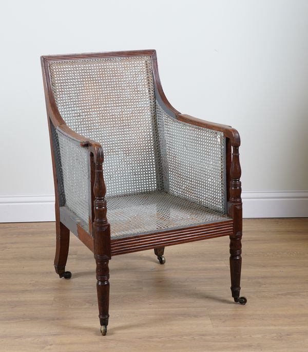 A REGENCY MAHOGANY FRAMED SQUARE BACK LIBRARY BERGERE CHAIR