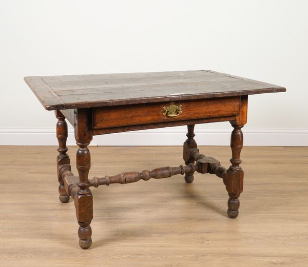 A 17TH CENTURY OAK CLEATED PLANK TOP SINGLE DRAWER SIDE TABLE