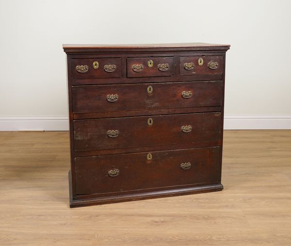 AN EARLY 18TH CENTURY PROVINCIAL OAK EIGHT DRAWER CHEST ON STAND