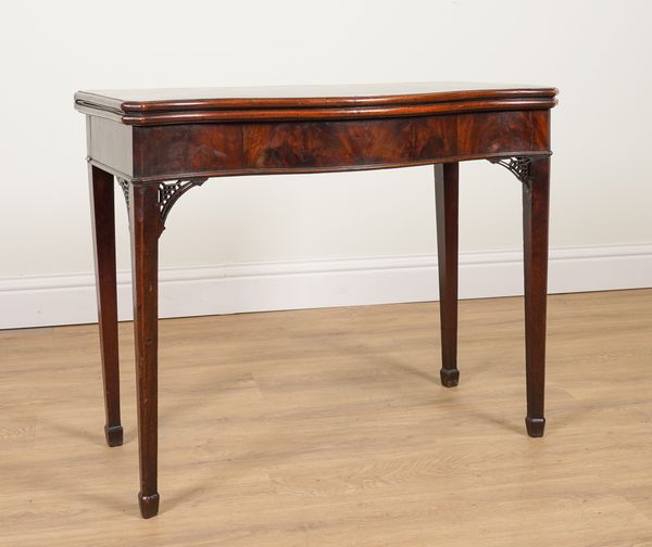 A GEORGE III SERPENTINE MAHOGANY FOLDOVER CARD TABLE