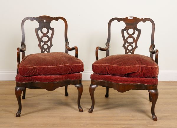 A PAIR OF EARLY 20TH CENTURY CONTINENTAL WALNUT FRAMED PIERCED SPLAT BACK OPEN ARMCHAIRS (2)