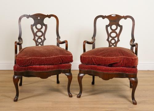 A PAIR OF EARLY 20TH CENTURY CONTINENTAL WALNUT FRAMED PIERCED SPLAT BACK OPEN ARMCHAIRS (2)