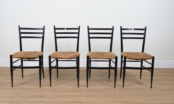 PROBABLY CHIAVARI SPINETTO; A SET OF FOUR ITALIAN RUSH SEATED EBONISED SIDE CHAIRS