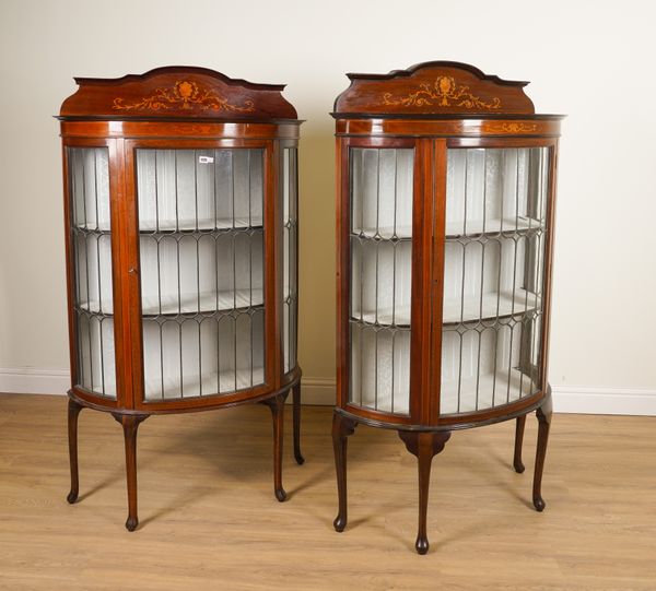 A PAIR OF EDWARDIAN MARQUETRY INLAID MAHOGANY LEADED GLASS BOWFRONT DISPLAY CABINETS (2)