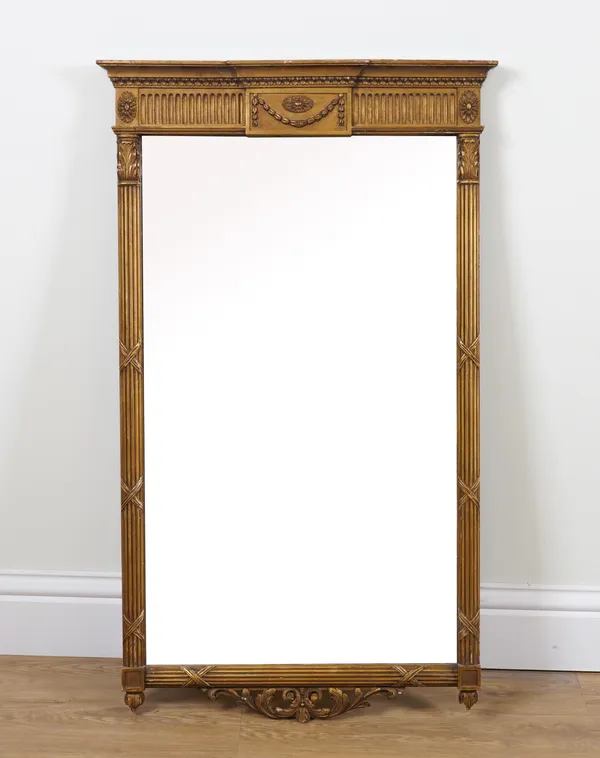 A REGENCY STYLE GILT FRAME PIER GLASS WITH RIBBON TIED REEDED COLUMNS