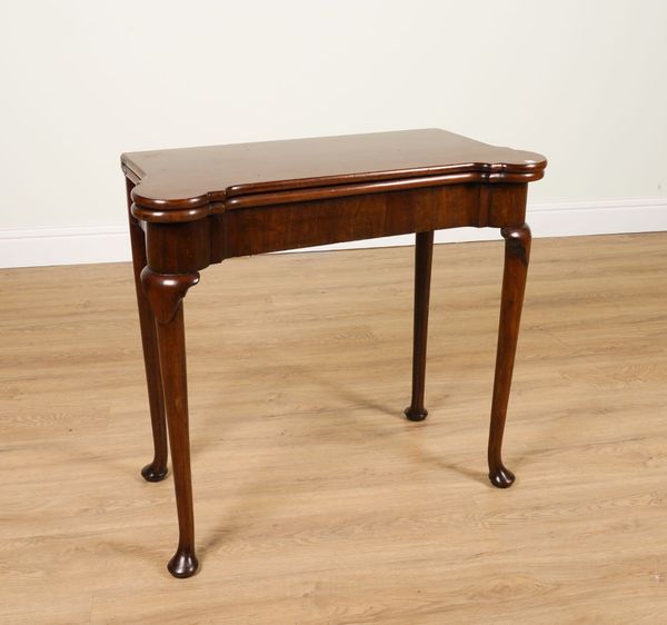 A GEORGE II MAHOGANY SHAPED RECTANGULAR FOLD-OVER CARD TABLE