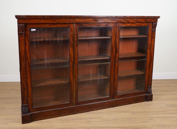 AN EARLY VICTORIAN MAHOGANY FLOOR-STANDING TRIPLE SECTION BOOKCASE