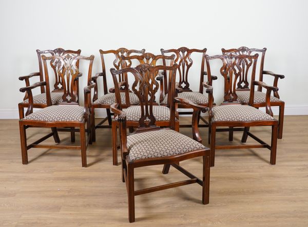 A SET OF EIGHT GEORGE III STYLE MAHOGANY PIERCED SPLAT BACK CARVER CHAIRS (8)