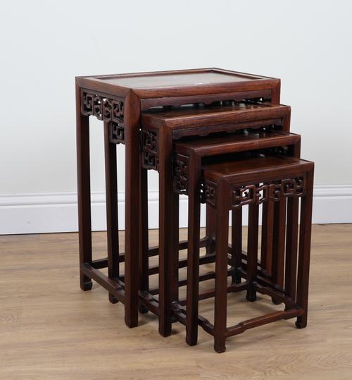 A NEST OF FOUR EARLY 20TH CENTURY CHINESE EXPORT HARDWOOD OCCASIONAL TABLES (4)